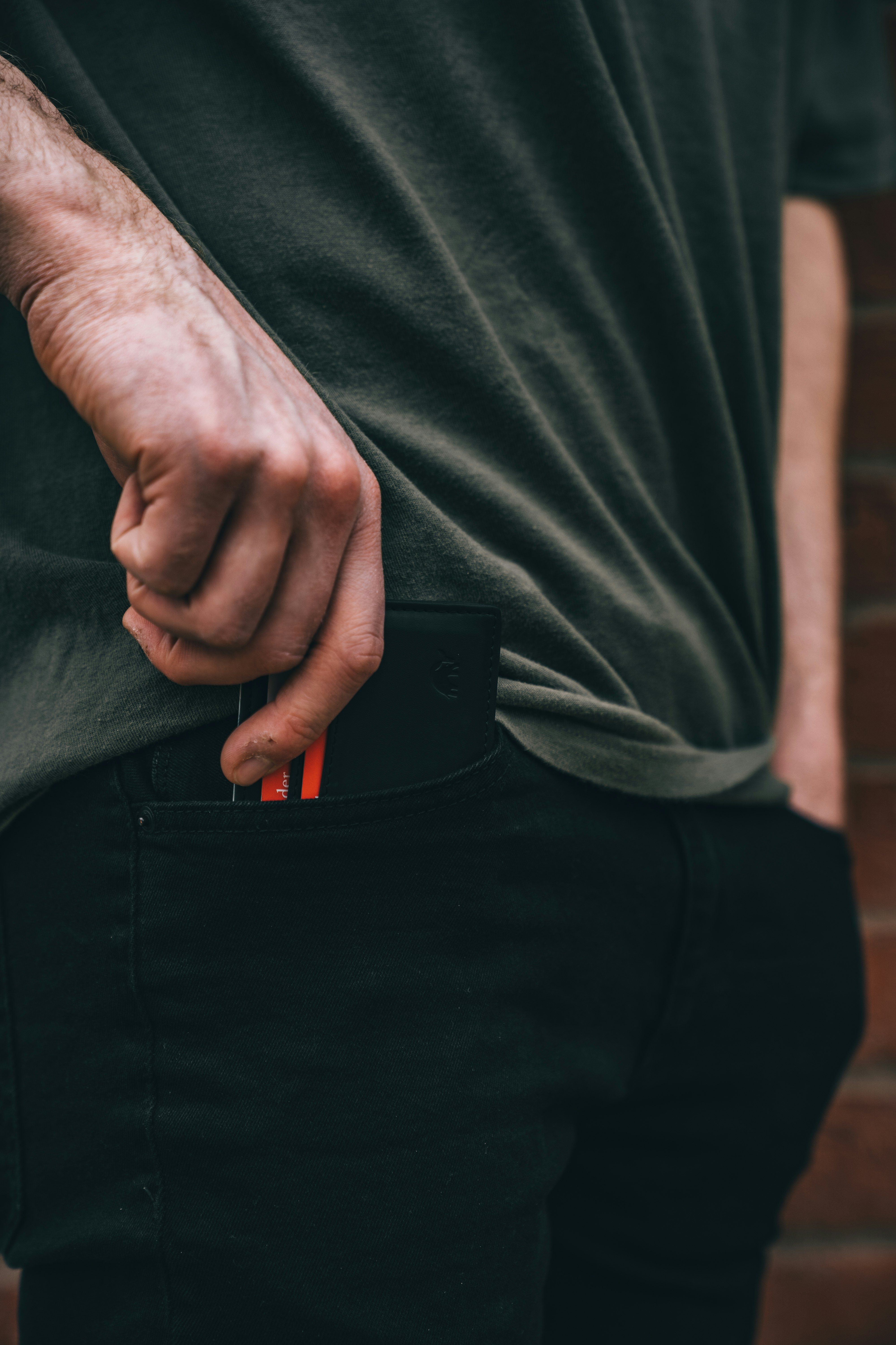 man in black shirt and black pants